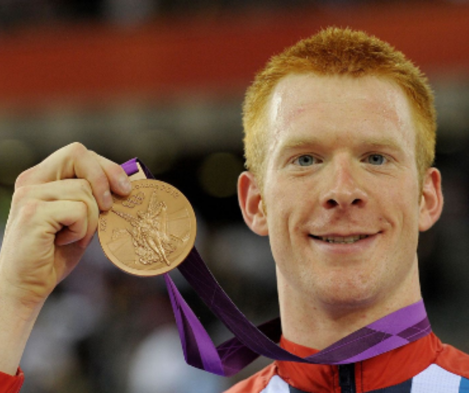 Ed Clancy OBE with one of his gold medals